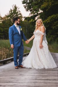 Tanis_Haakinson_March81 Photography_Grand Rapids Wedding Photographer-The Ravines Saugatuck-Bride and Groom Dancing on Bridge_low