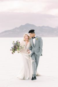 A couple ont their wedding day at the Salt Flats, in Utah Cotton Candy Skies Elopement Styled Shoot over the Bonneville Salt Flats