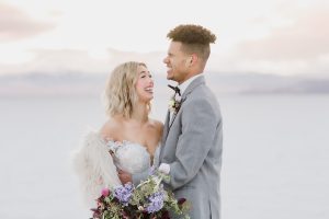A couple ont their wedding day at the Salt Flats, in Utah Cotton Candy Skies Elopement Styled Shoot over the Bonneville Salt Flats