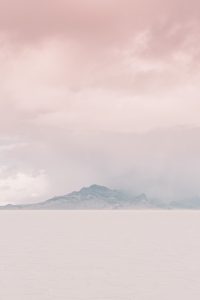 A couple ont their wedding day at the Salt Flats, in Utah Cotton Candy Skies Elopement Styled Shoot over the Bonneville Salt Flats