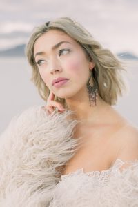 A couple ont their wedding day at the Salt Flats, in Utah Cotton Candy Skies Elopement Styled Shoot over the Bonneville Salt Flats