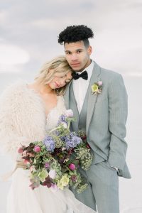 A couple ont their wedding day at the Salt Flats, in Utah Cotton Candy Skies Elopement Styled Shoot over the Bonneville Salt Flats