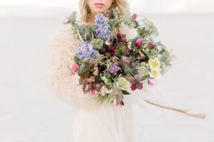 A couple ont their wedding day at the Salt Flats, in Utah Cotton Candy Skies Elopement Styled Shoot over the Bonneville Salt Flats