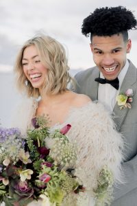 A couple ont their wedding day at the Salt Flats, in Utah Cotton Candy Skies Elopement Styled Shoot over the Bonneville Salt Flats