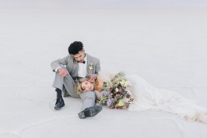 A couple ont their wedding day at the Salt Flats, in Utah Cotton Candy Skies Elopement Styled Shoot over the Bonneville Salt Flats