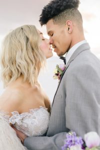 A couple ont their wedding day at the Salt Flats, in Utah Cotton Candy Skies Elopement Styled Shoot over the Bonneville Salt Flats