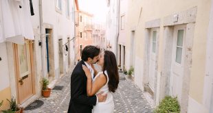 Daniela and Adrian's Sun-Filled Engagement in the Colorful Streets of Portugal